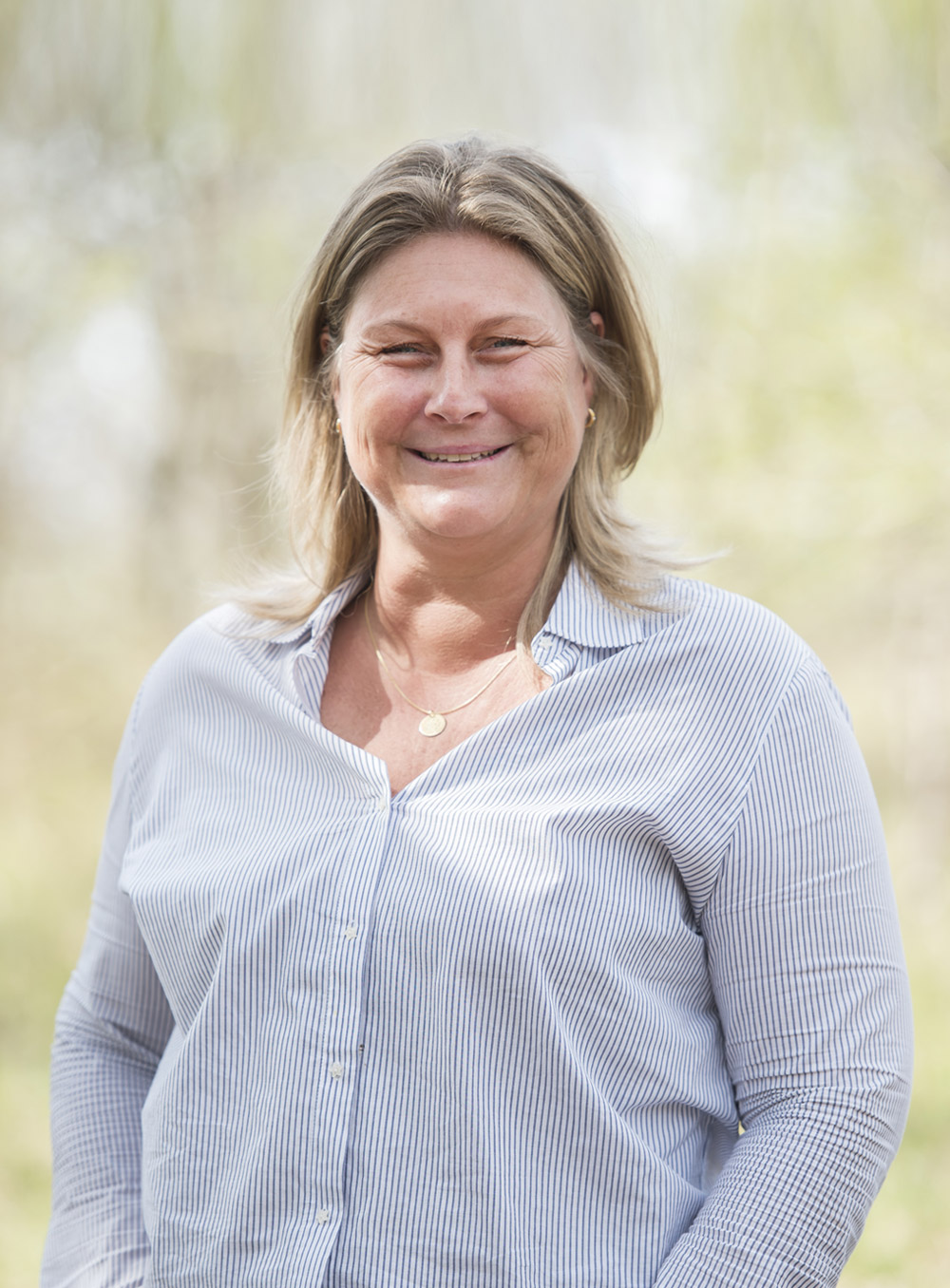 Assistant Monique Rombaut outside